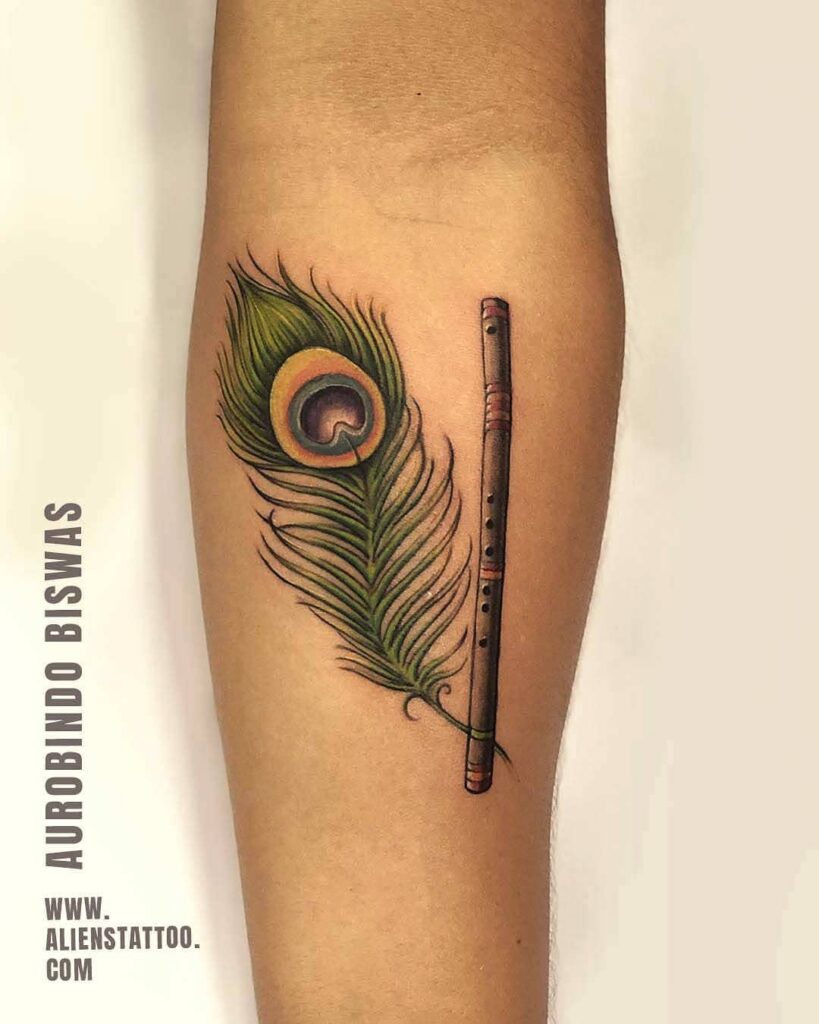 Krishna's melody and the graceful peacock feather a forearm tattoo story
