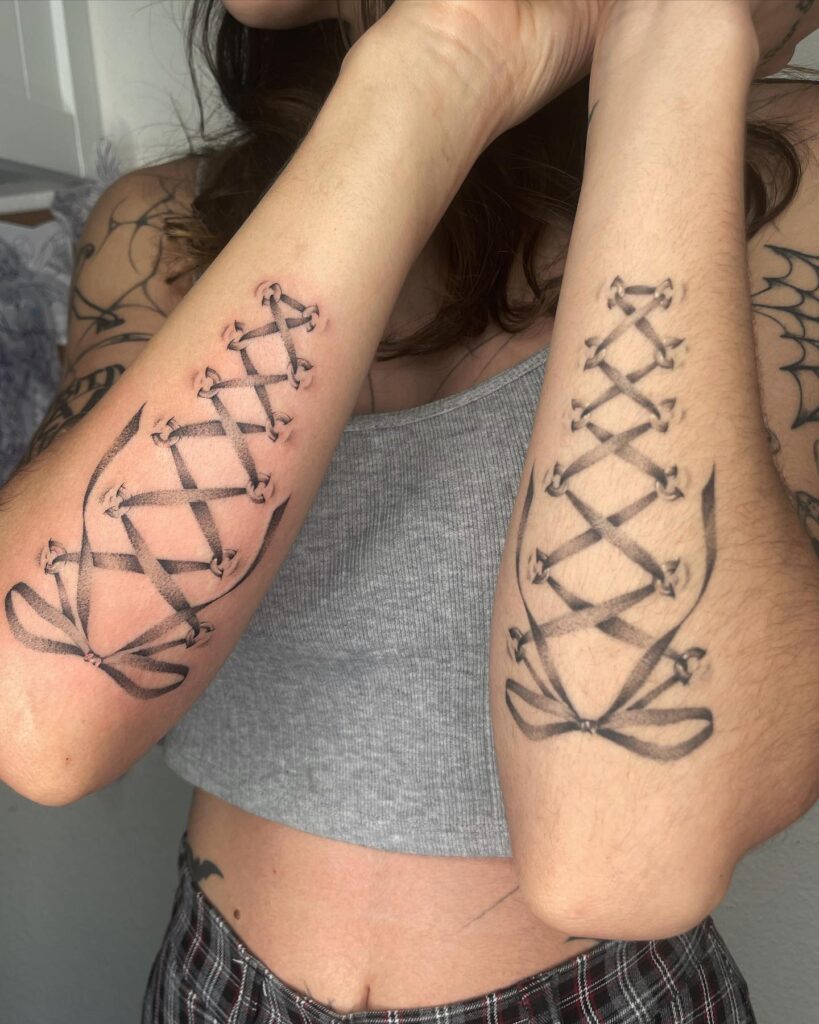Lacing beauty shoelace tattoos adorning both outer forearms for girls