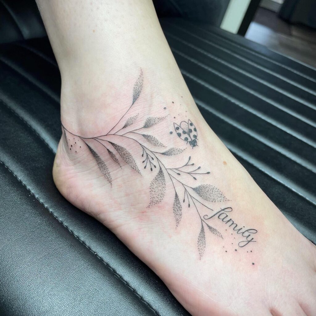 Ladybug Tattoo Design For Leg Sitting On Dotted Leafs