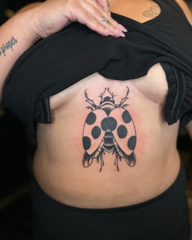 Latest Trend Black Ladybug Stomach Tattoos for Females Showcasing Confidence and Style