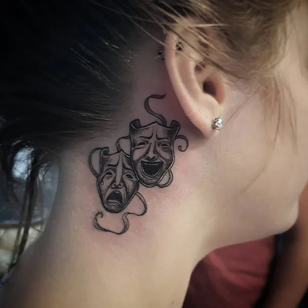 Laugh now cry later behind the ear tattoo