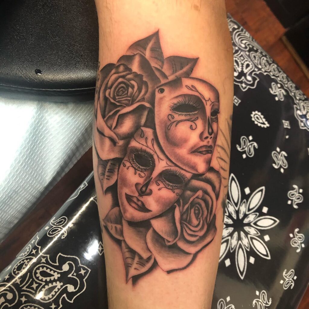 Laugh Now Cry Later Mask with Roses Tattoo: Side of the Forearm Elegance