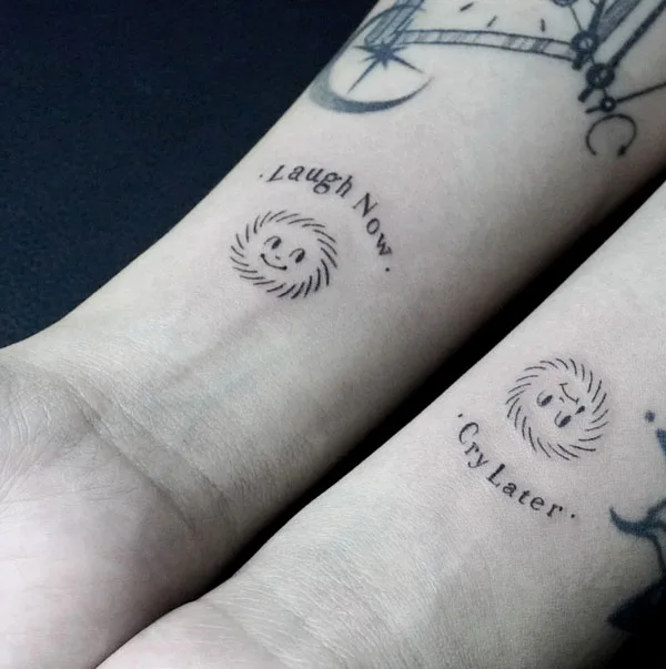 Laugh now cry later wrist tattoo