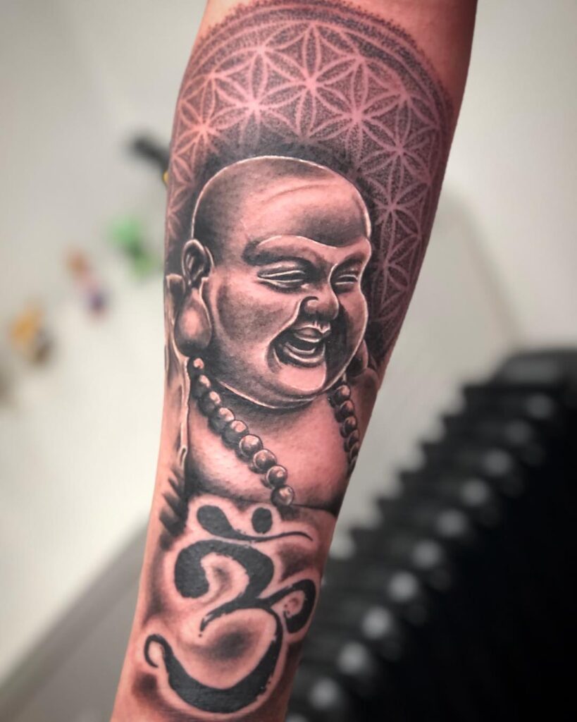 Laughing Buddha with Om Symbol Forearm Tattoo Spiritual Harmony and Universal Consciousness