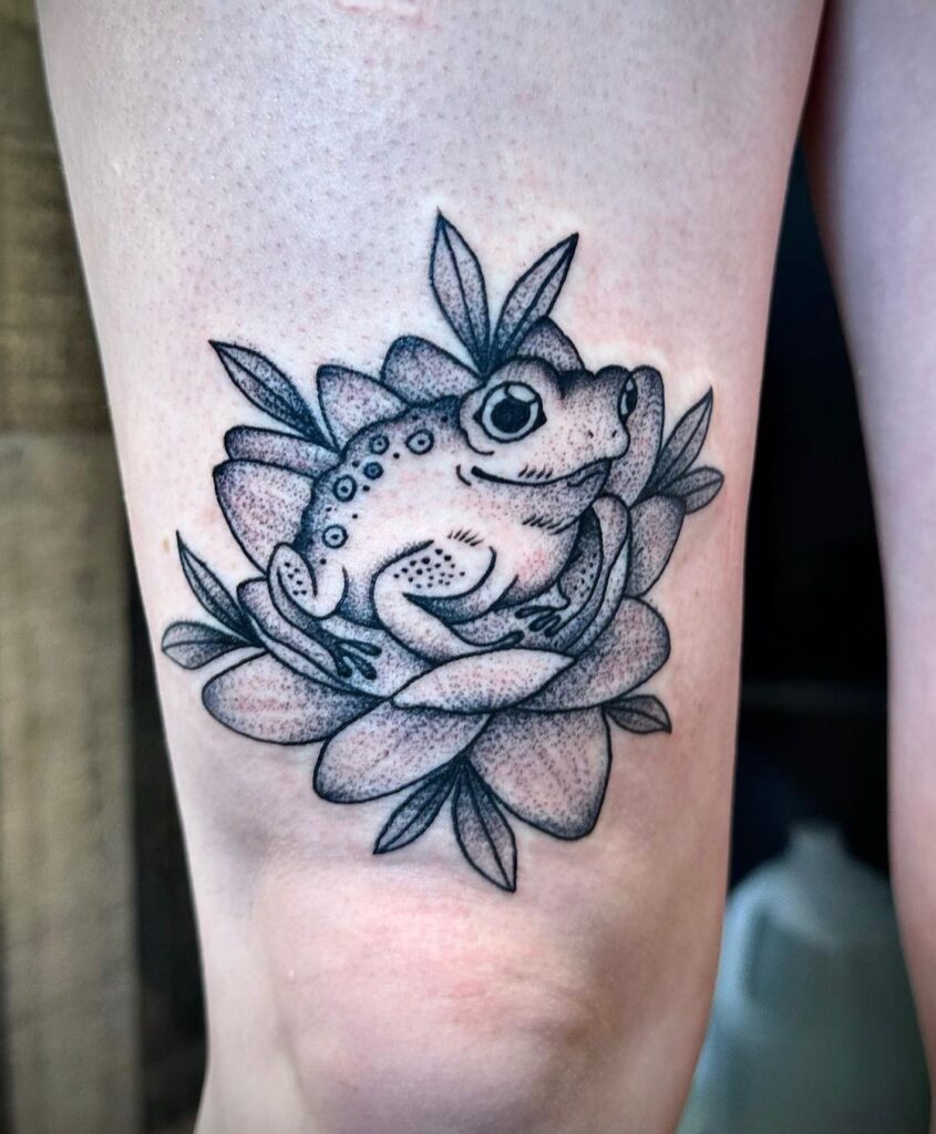 Leap into nature tree frog tattoo above the knee