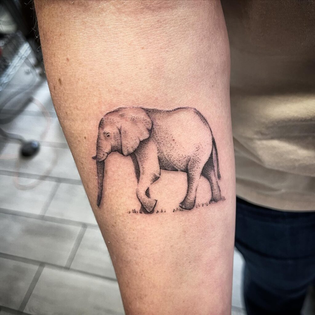 Leftward side view elephant in black ink: simple forearm wonder