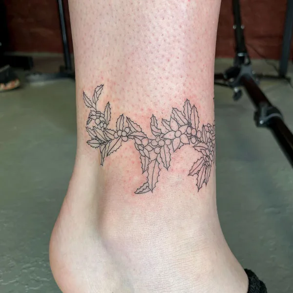 Leg December birth flower tattoo
