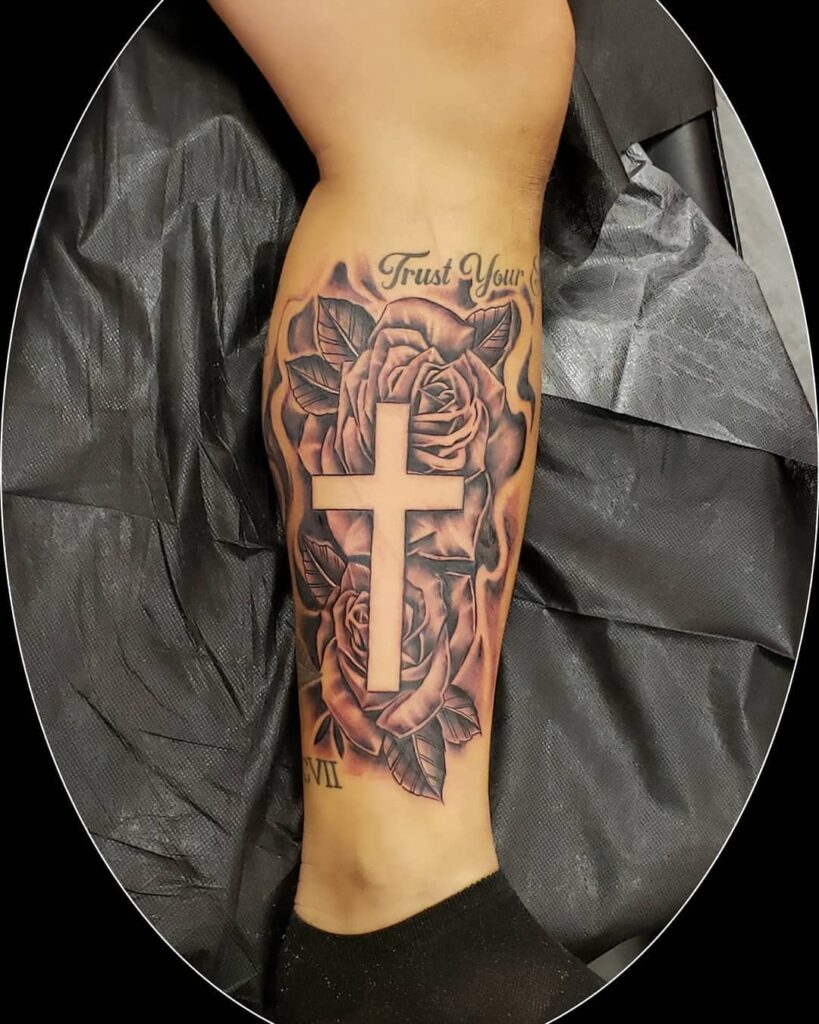 Leg Tattoo with Custom Text Personalizing the Cross and Rose Design for Women