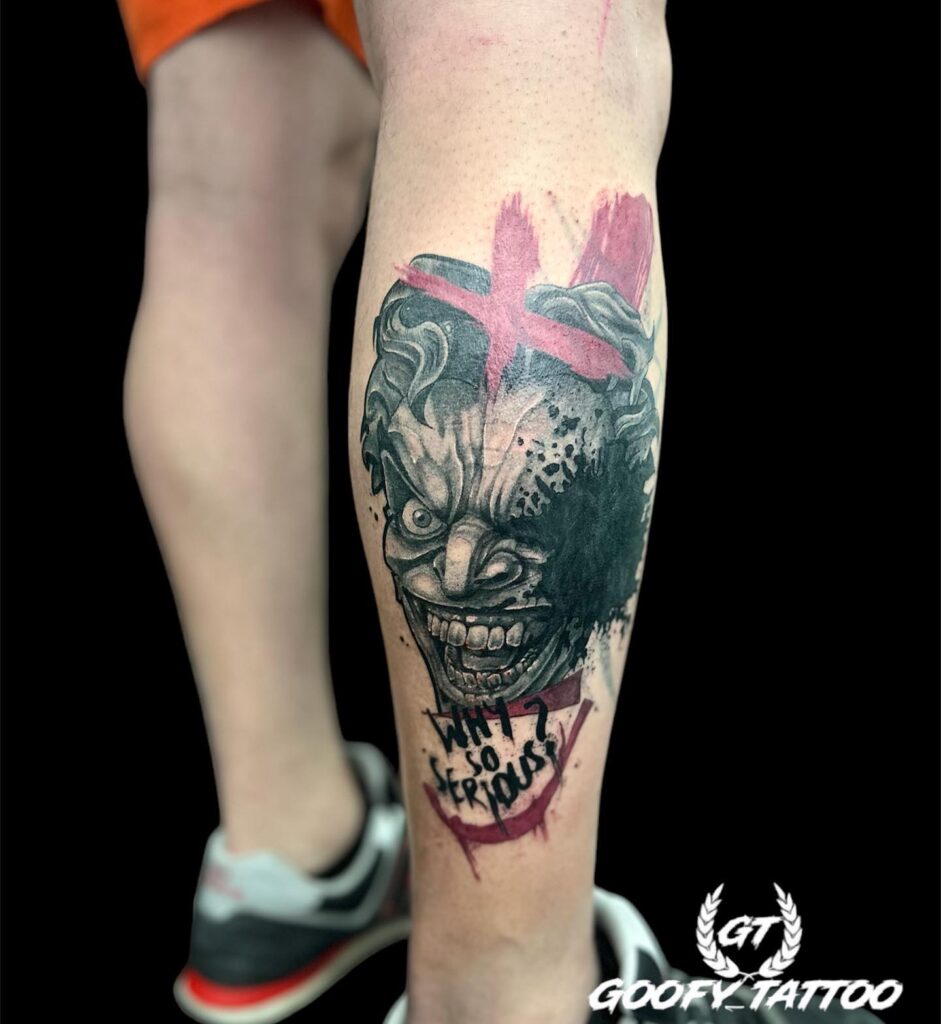 Leg Back Tattoo Joker Design: Angry Face and "Why So Serious" Text - Captivating Tattoo Idea