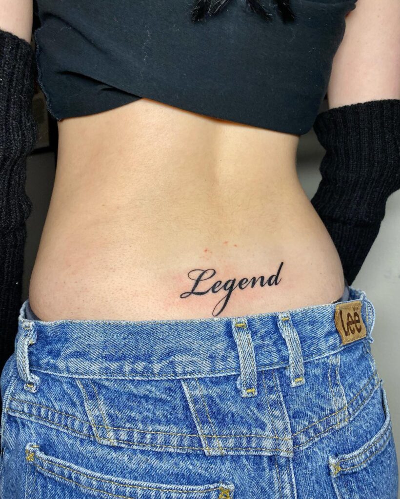 'Legend' Bold Script Lettering Tattoo, Striking on the Lower Back: Legendary Mark