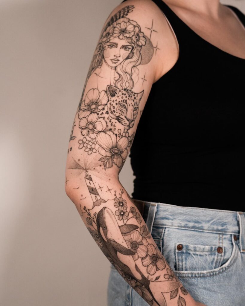 Leopard and celestial-themed tattoo sleeve with a mystical feminine figure