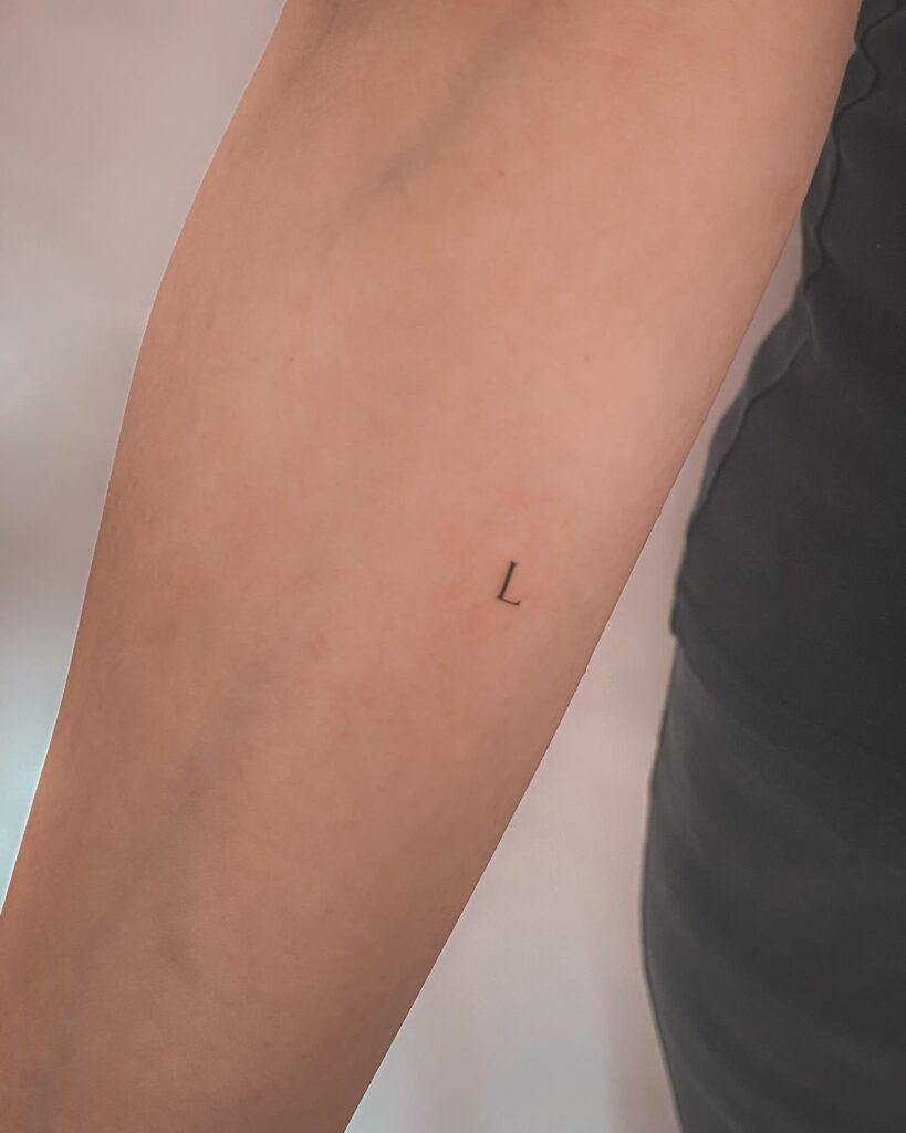 Letter 'L' Tattoo Gracefully Inked on the Side: Forearm Flourish