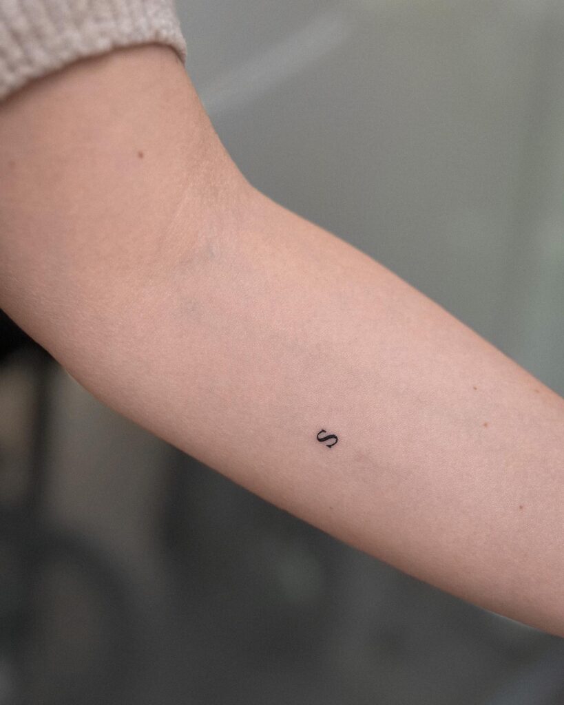 Letter 'S' Tattoo on the Side of the Forearm: Subtle Charm