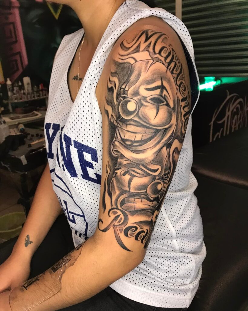 Lettering Tattoo: "MantenteReal" Joker Tattoo for Women Arm