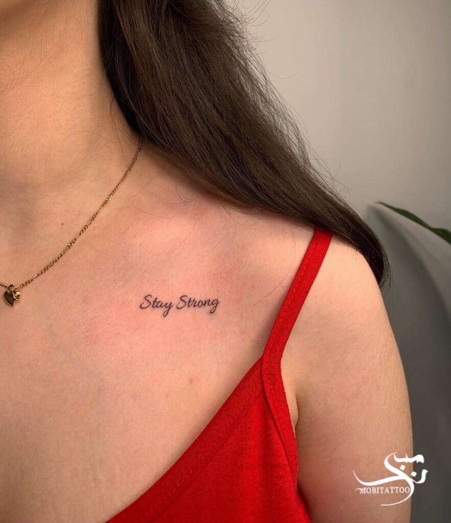 Light-bold font lettering on the collarbone: 'Stay strong'