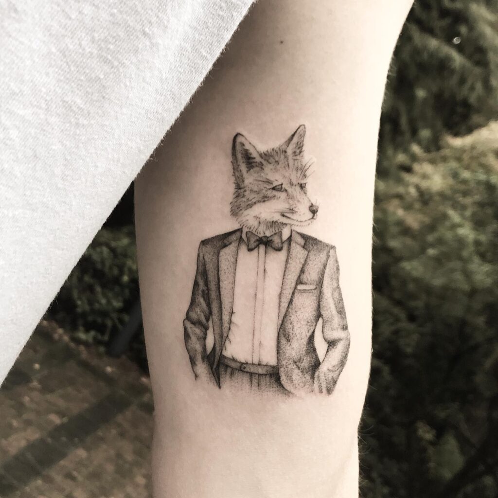 Lightly Shaded Tuxedo Fox in a Suit Illustrative Tattoo on the Bicep: Tuxedo Tails