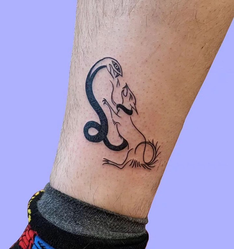 Line Work Tattoo of a Dog and Snake in Battle Above the Ankle: Epic Showdown