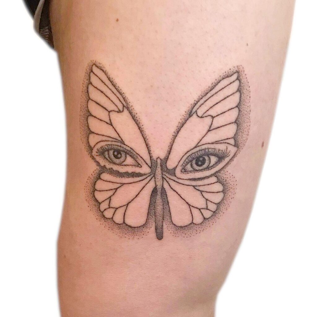 Lined Butterfly Tattoos on the Thigh With Open Eyes