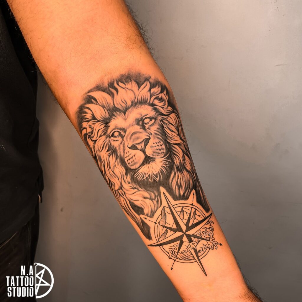 Lion Face & Compass Tattoo on the Forearm for a Majestic Journey: Regal Navigation