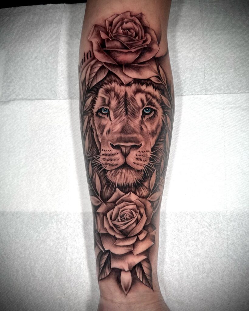 Lion head and two roses tattoo on the inner forearm: forearm family