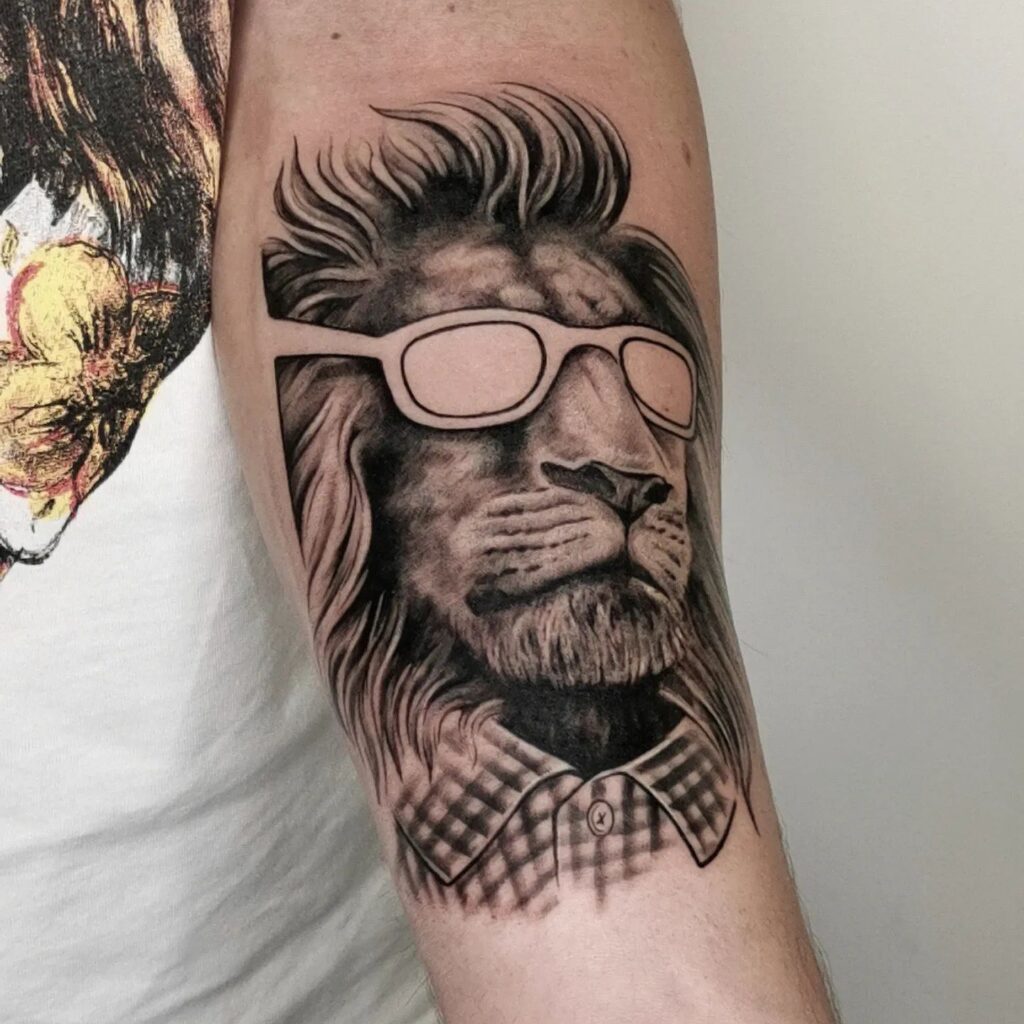 Lion head converted into a men's face with specs, hairstyle, and shirt on the arm: men's metamorphosis