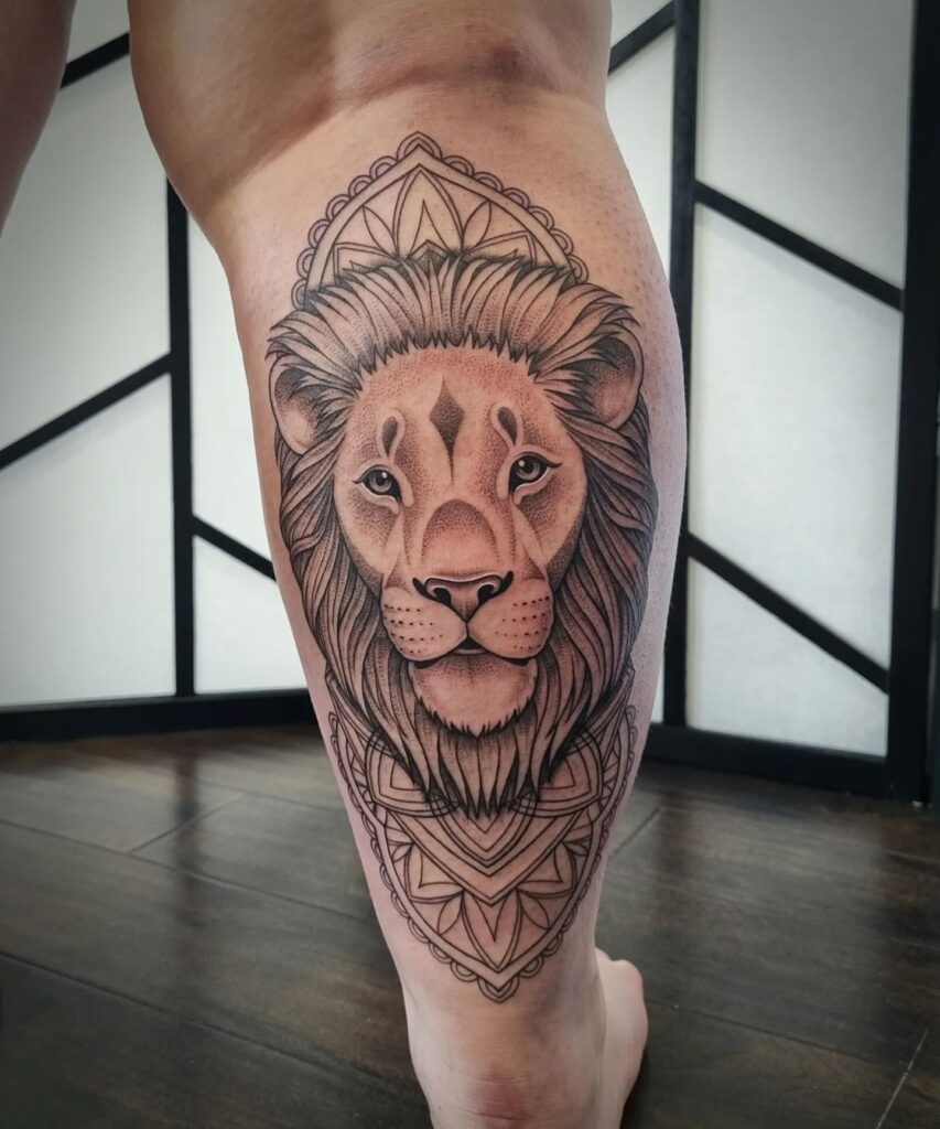 Lion Head Tattoo Dominates the Calf, Accompanied by a Mandala Behind: Regal Roar 