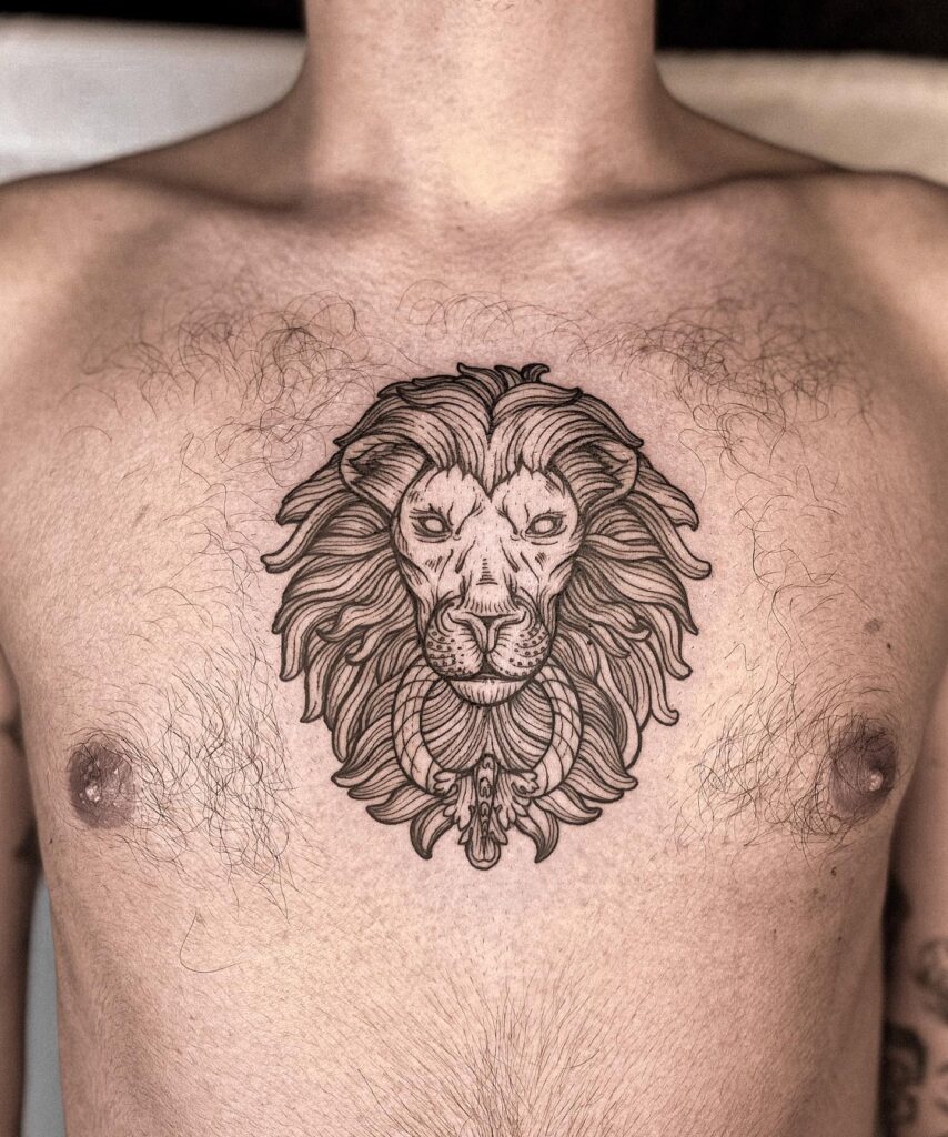 Lion tattoo on the chest with intricate engraving art for men: regal engraving