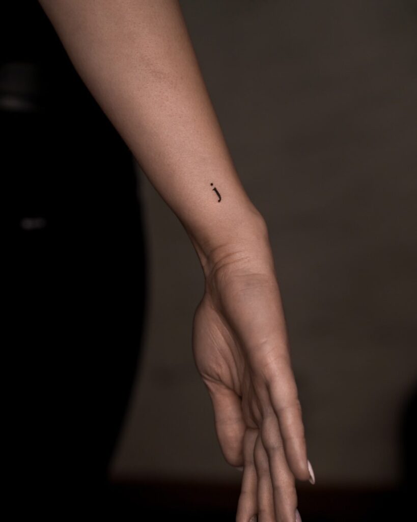Little 'J' Letter on the Side of the Wrist Tattoo for Girls: Subtle Detail, a Dainty Accent