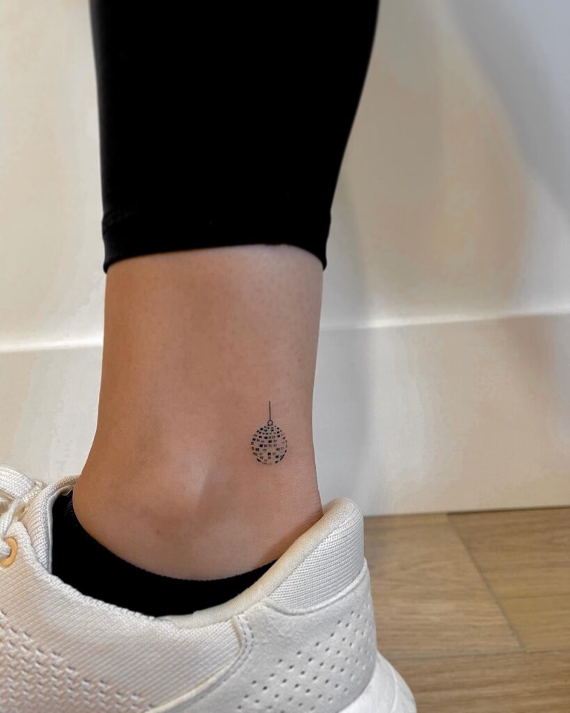 Little Disco Ball Tattoo Near the Ankle, a Fine Line of Retro Elegance: Disco Finesse