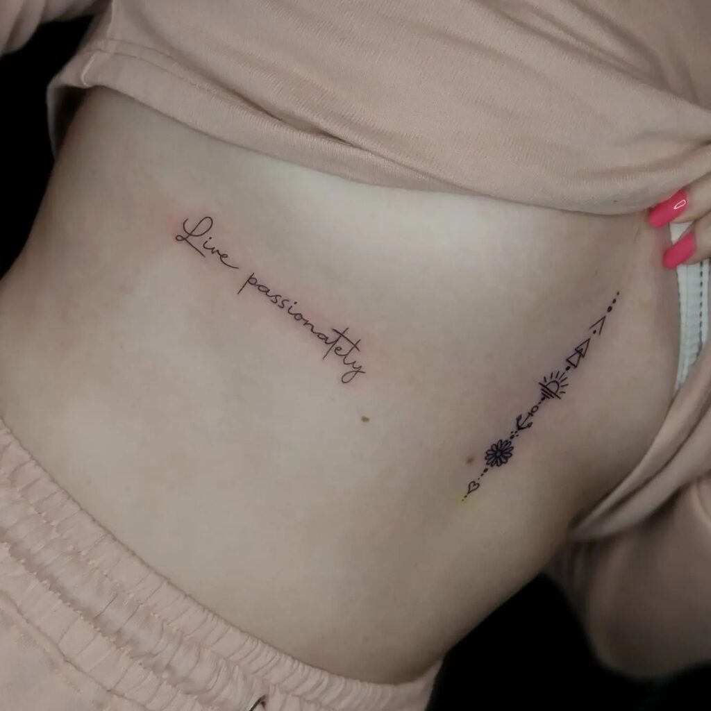 "Live passionately" handwriting script lettering tattoo across the rib-passionate reminder