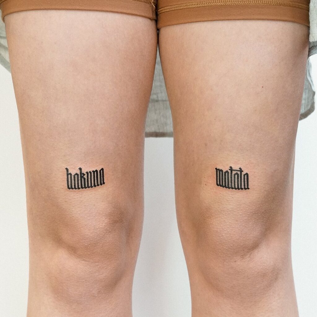 Living hakuna matata forever a dual-leg tattoo with a carefree message