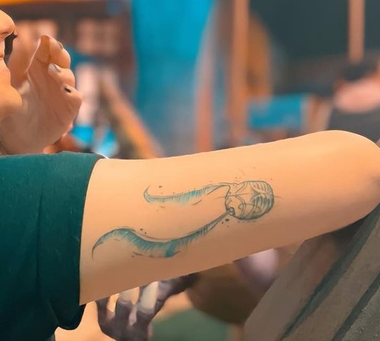 Long Wings Golden Snitch Biceps Tattoos