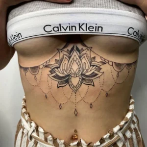 Lotus under boob tattoo 1