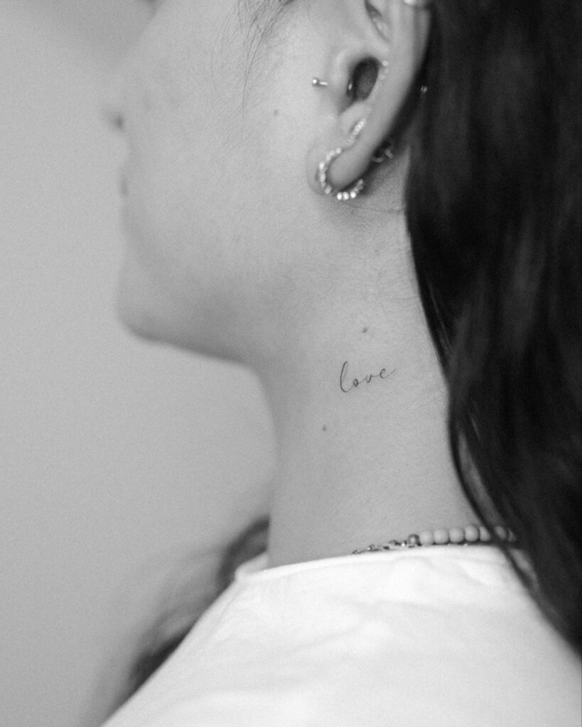 Love Cursive Neck Tattoo Simple Elegant and Emotionally Meaningful