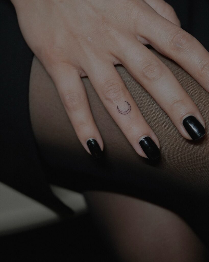 Lovely Outline Crescent Moon Tattoo on Ring Finger: Celestial Whispers