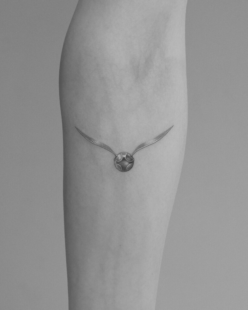 Lower arm fascination forearm golden snitch tattoo ideas for females