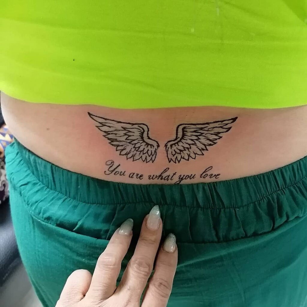 Lower Back Wing Tattoo with 'You Are What You Love' Below, a Luminescent Duo: Lumbar Lift