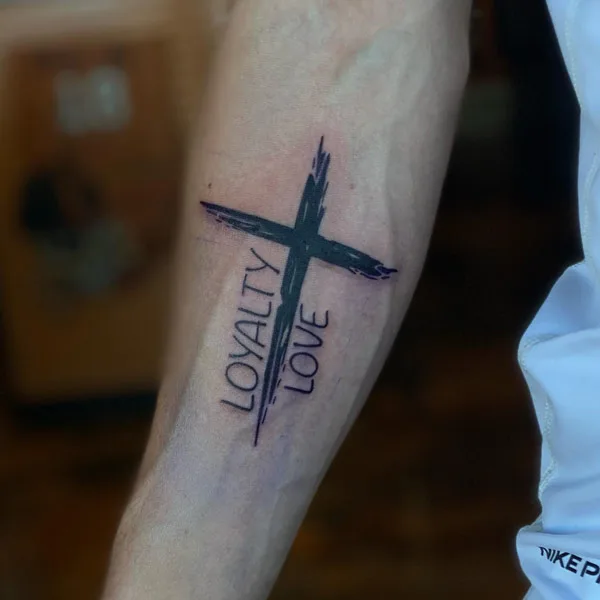 Loyalty over love cross tattoo