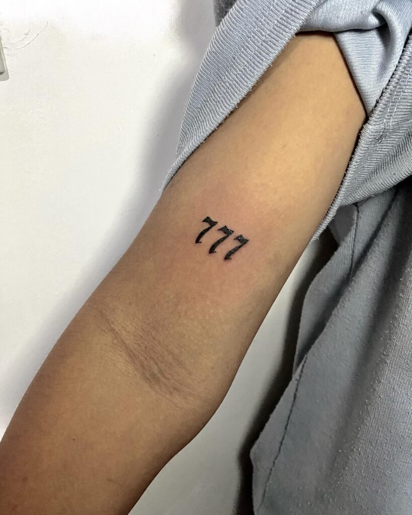 Lucky 777 in Striking Font Above the Elbow: Bold Elegance 