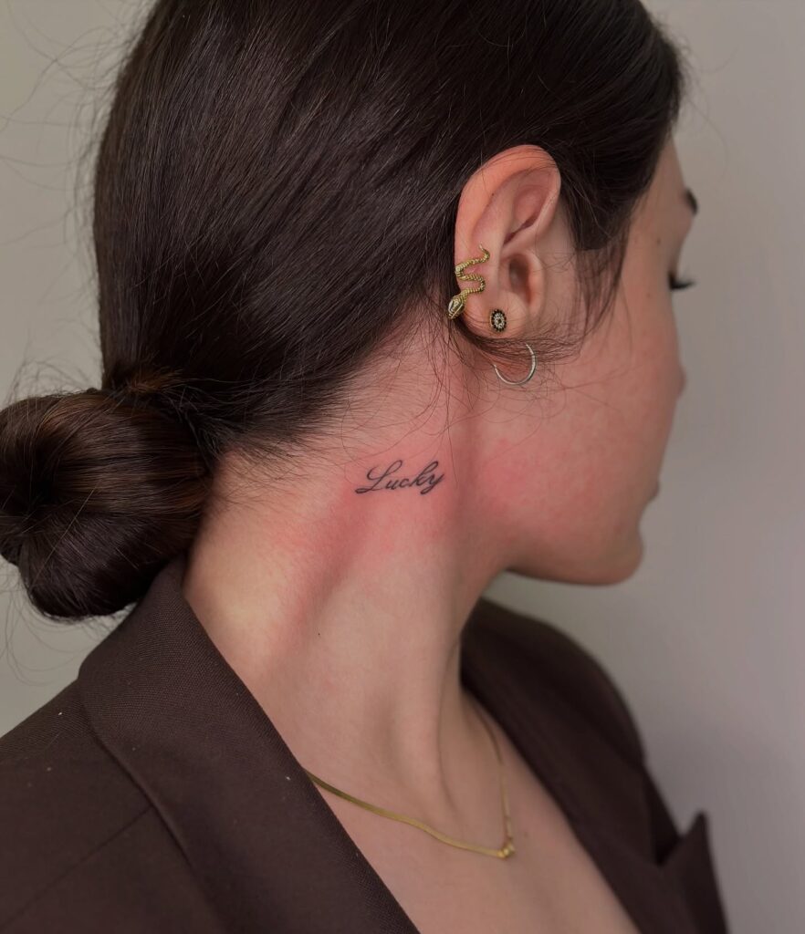 Lucky Cursive Neck Tattoo Subtle Stylish and Symbolic of Gratitude