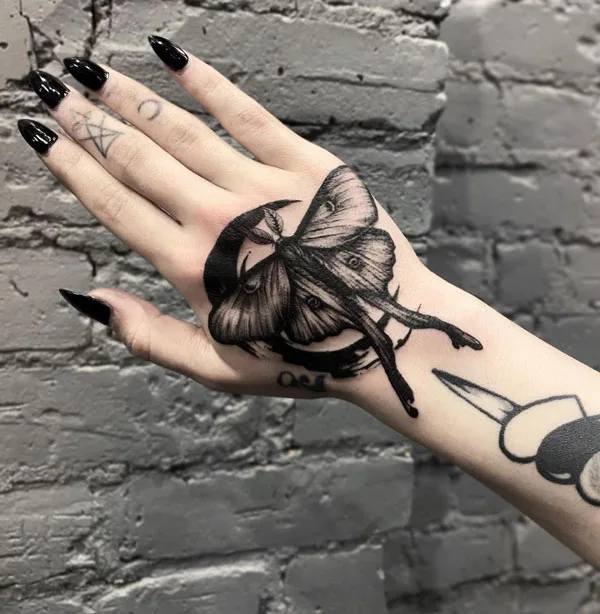 Luna Moth hand tattoo
