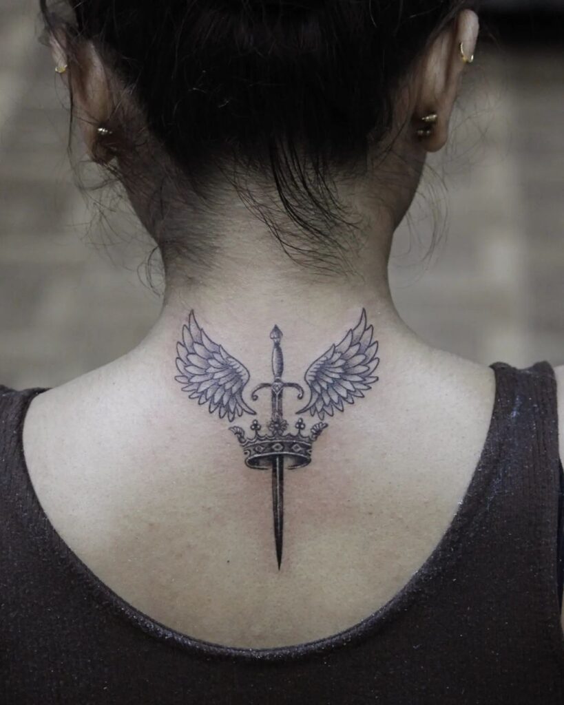 Majestic ink sword tattoo with crown and wings on the nape