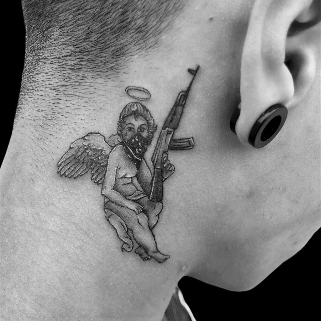 Male Angel with Wings and Gun Tattoo on the Side Neck: Guardian Arsenal
