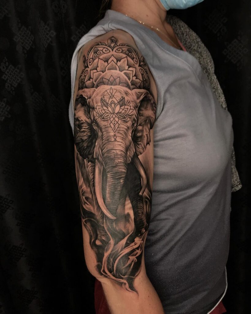 Mandala elephant tattoo realistic and heritage, half upper arm sleeve tattoo in black ink heritage majesty