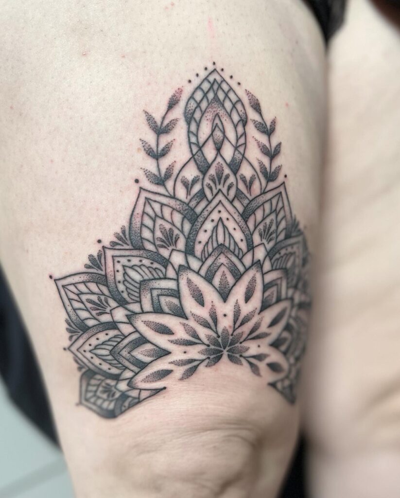Mandala magic above the knee tattoo for females
