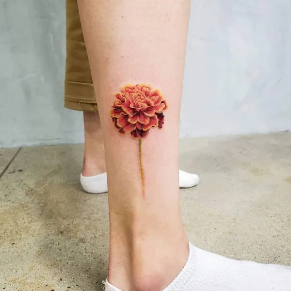 Marigold tattoo on leg 1