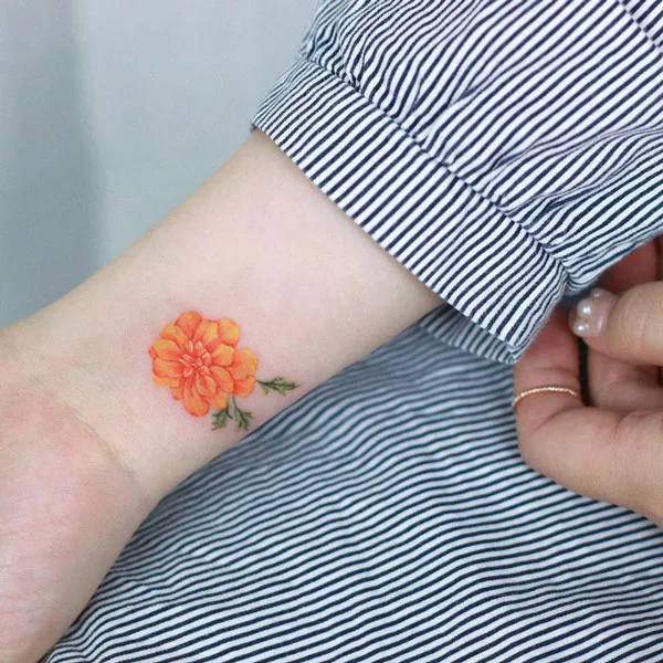 Marigold tattoo on wrist 1