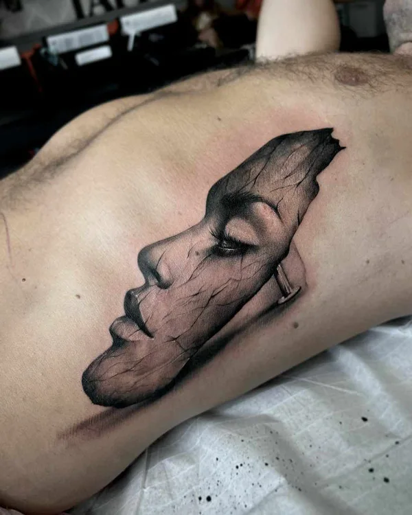 Mask Rib Tattoo