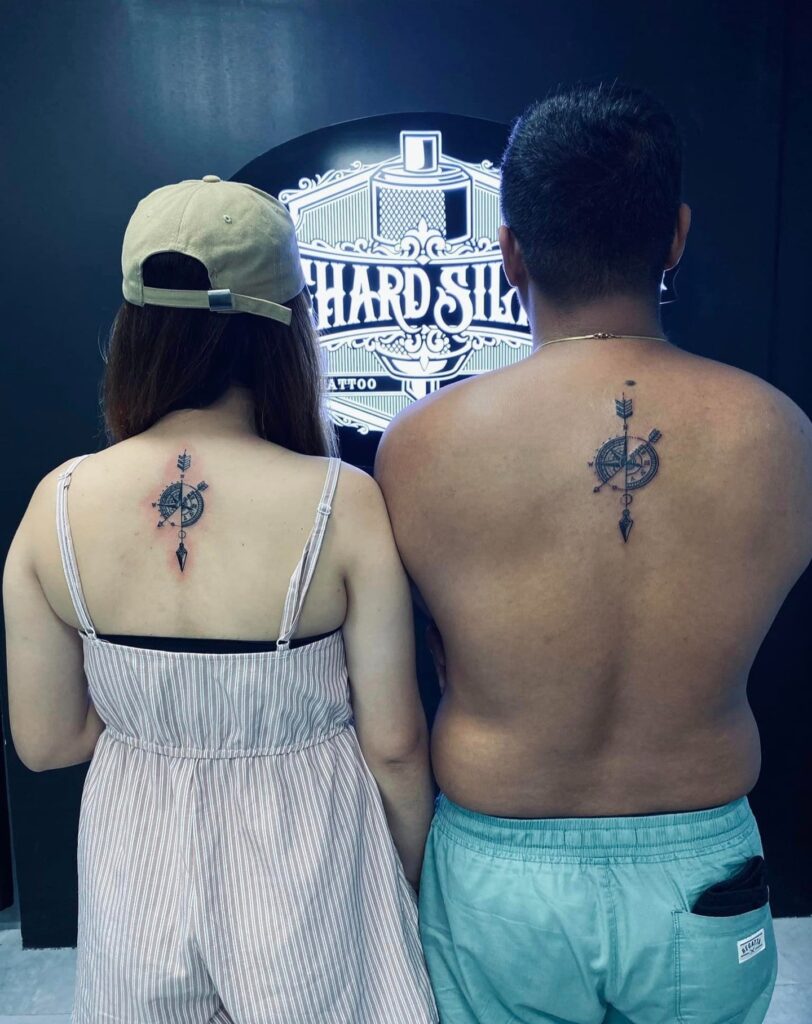Matching Black and Grey Compass Tattoo on the Back of the Neck for Partners: Couple's Bearings