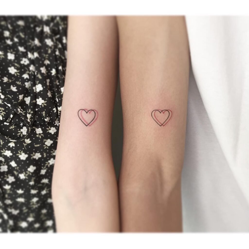 Matching double love heart tattoos symbolic ink for couples